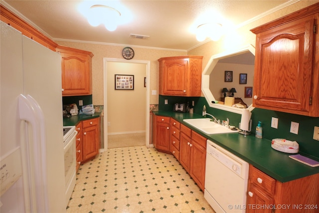 kitchen with white appliances, sink, crown molding, and light tile patterned floors