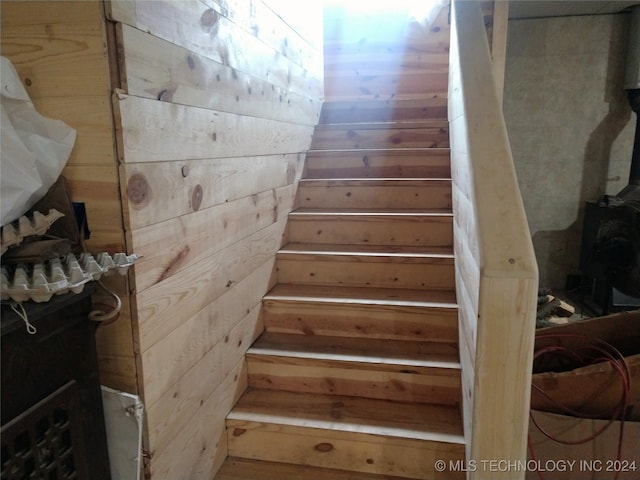 stairs with wood walls