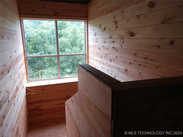 view of sauna / steam room featuring wood walls