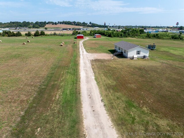 birds eye view of property with a rural view