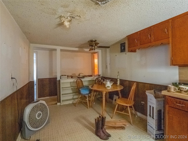 kitchen with a textured ceiling and ceiling fan