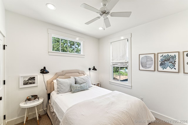 carpeted bedroom with ceiling fan