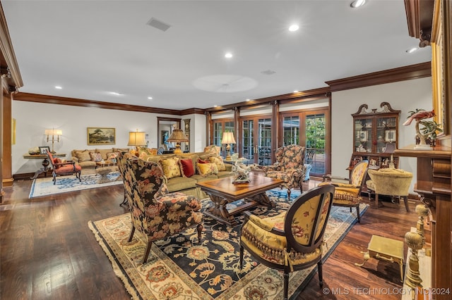 dining space featuring dark wood-type flooring and crown molding