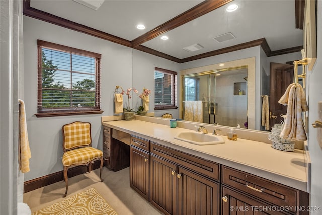 bathroom with crown molding, a shower with door, and vanity