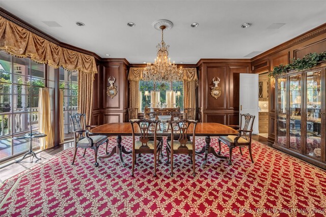 dining space featuring an inviting chandelier and ornamental molding