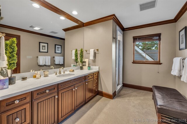 bathroom featuring crown molding, an enclosed shower, and vanity