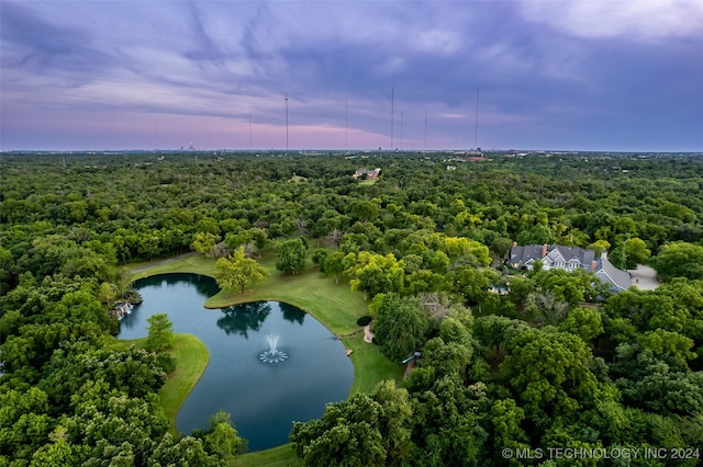 aerial view at dusk with a water view