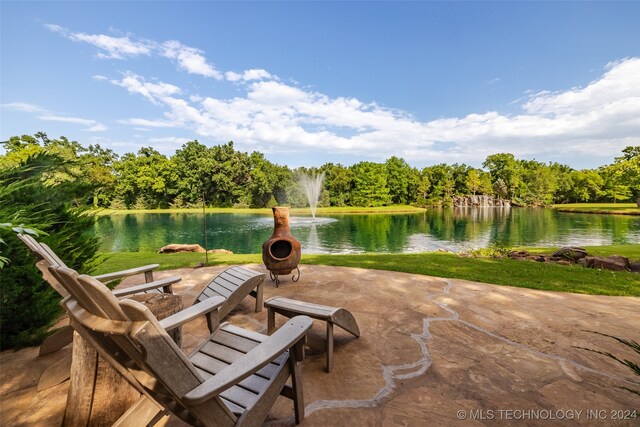 view of patio with a water view