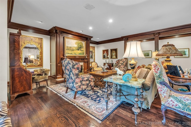 living area with ornamental molding, wood finished floors, and recessed lighting