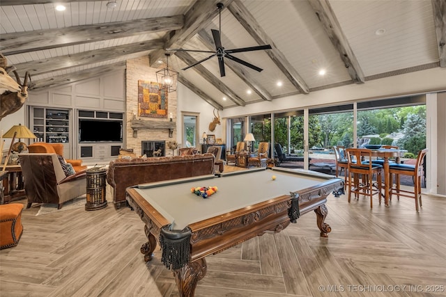 rec room featuring high vaulted ceiling, beam ceiling, a fireplace, and a ceiling fan