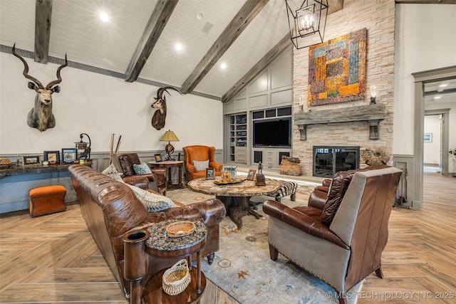 living room featuring high vaulted ceiling, beam ceiling, a decorative wall, and a stone fireplace