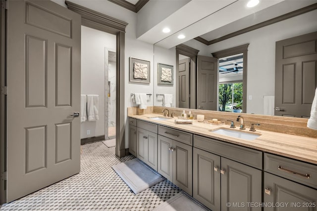 full bath with double vanity, ornamental molding, a sink, and recessed lighting