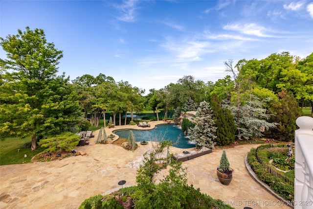 outdoor pool featuring a patio area