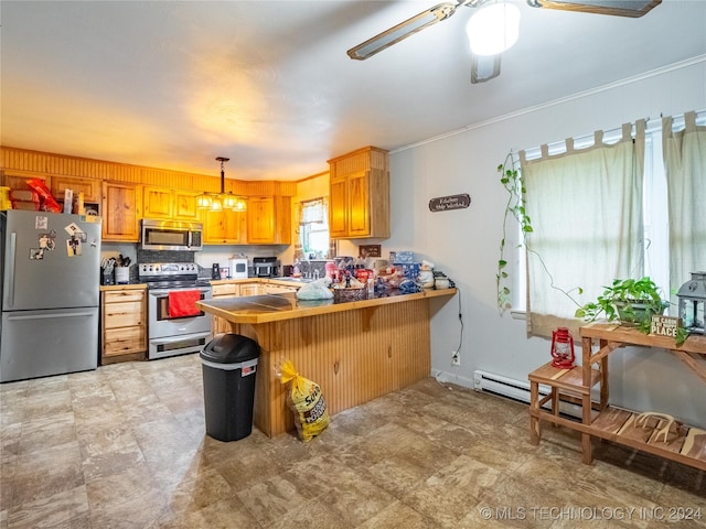 kitchen with pendant lighting, a breakfast bar, appliances with stainless steel finishes, ceiling fan with notable chandelier, and kitchen peninsula