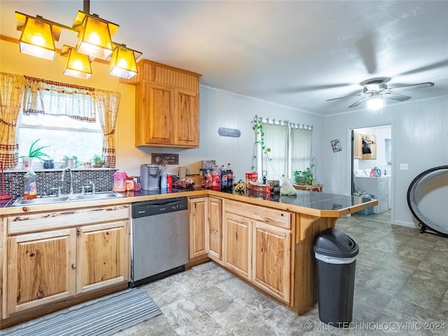 kitchen with washer / clothes dryer, sink, stainless steel dishwasher, tile counters, and kitchen peninsula