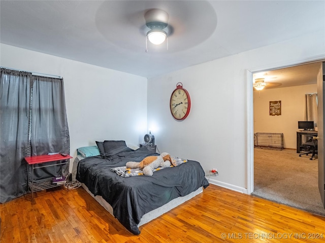 bedroom with hardwood / wood-style flooring and ceiling fan