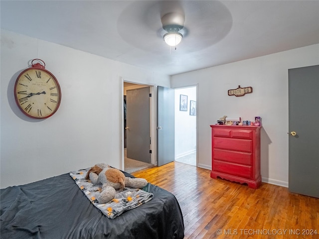 bedroom featuring ceiling fan and light hardwood / wood-style floors