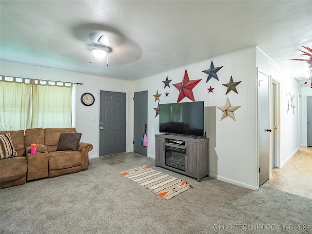 carpeted living room with ceiling fan