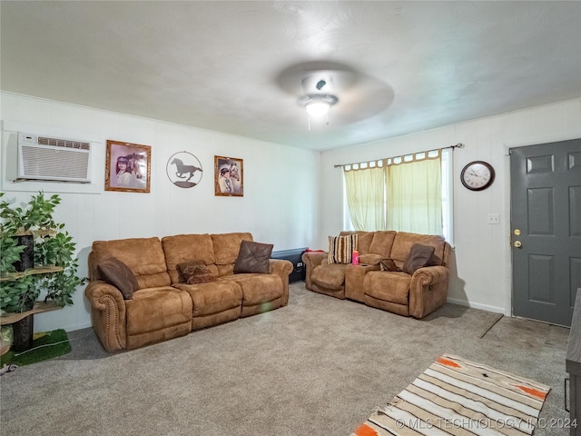 carpeted living room with a wall mounted air conditioner and ceiling fan