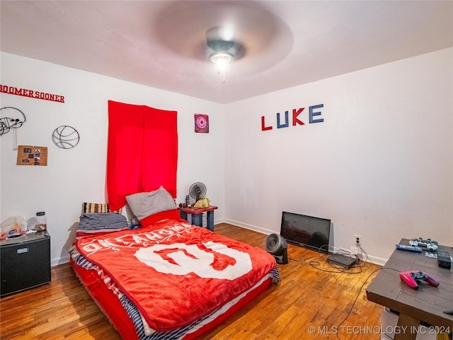 bedroom with hardwood / wood-style floors