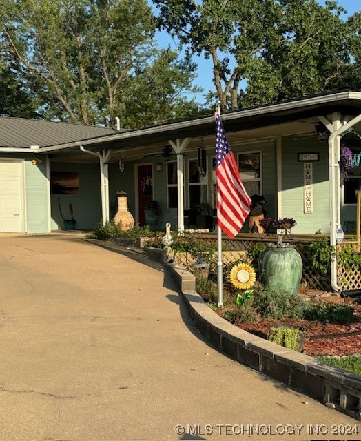 ranch-style house featuring a porch and a garage