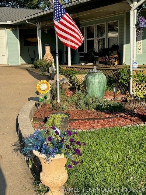 view of yard featuring covered porch