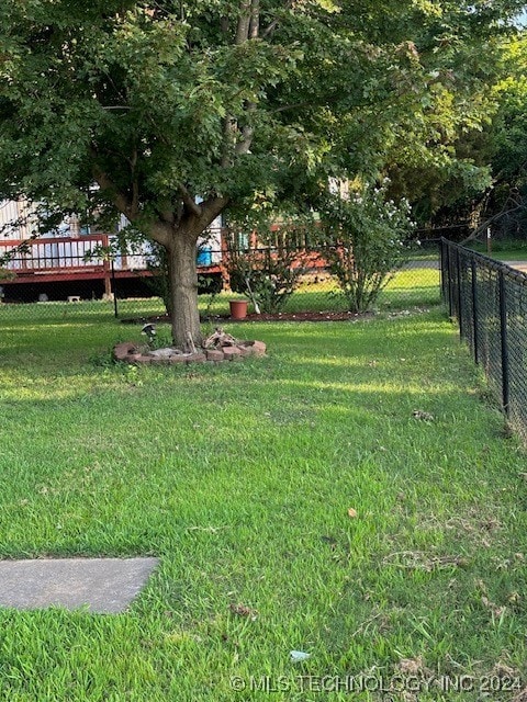 view of yard featuring a wooden deck