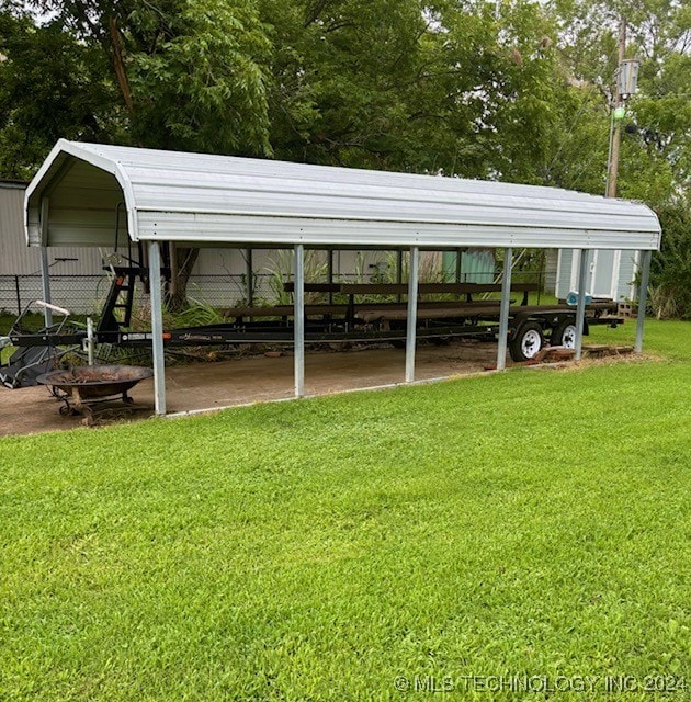 exterior space featuring a yard and a carport