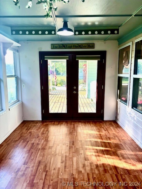 entryway featuring french doors and hardwood / wood-style floors