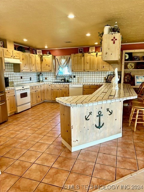 kitchen featuring light brown cabinetry, white appliances, tile countertops, light tile patterned flooring, and tasteful backsplash