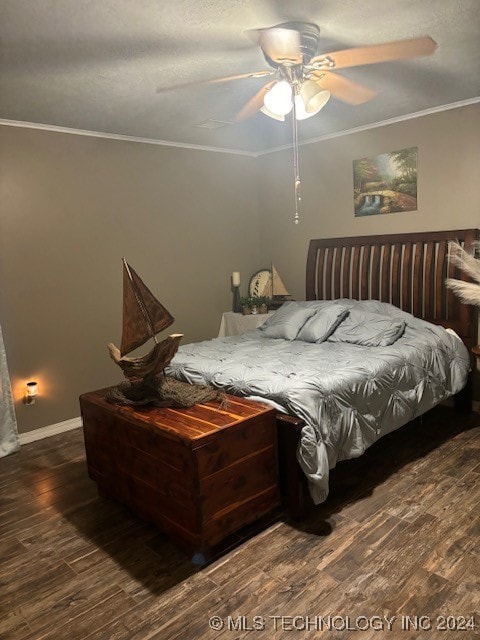 bedroom featuring ceiling fan, dark wood-type flooring, and ornamental molding