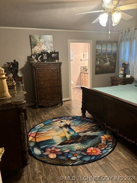 bedroom featuring a textured ceiling, hardwood / wood-style floors, ceiling fan, and ensuite bathroom