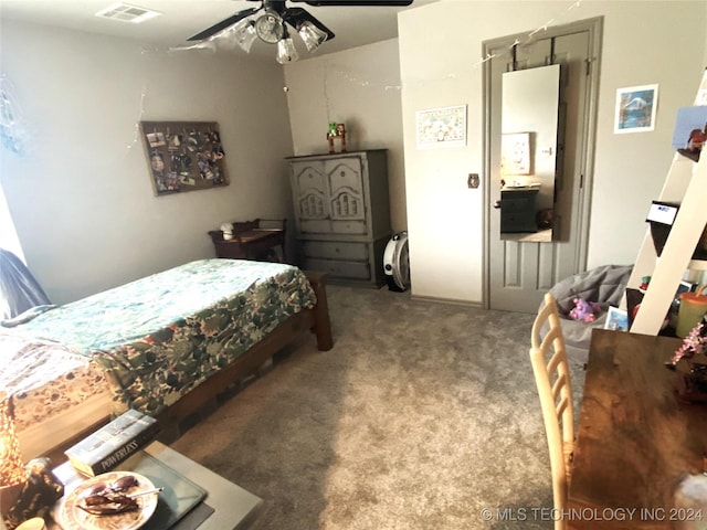 bedroom with carpet, visible vents, and a ceiling fan