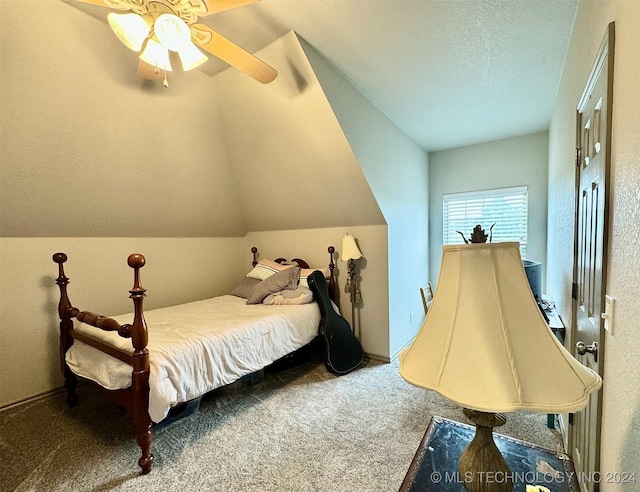 carpeted bedroom with lofted ceiling, ceiling fan, and a textured ceiling