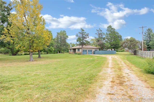 view of yard with a garage