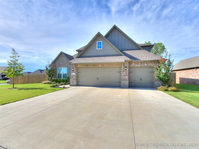 craftsman-style home with a garage and a front yard