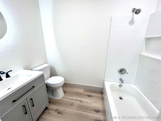 full bathroom featuring vanity, toilet, shower / bathing tub combination, and hardwood / wood-style floors