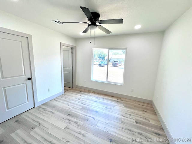 unfurnished bedroom featuring ceiling fan and light hardwood / wood-style floors