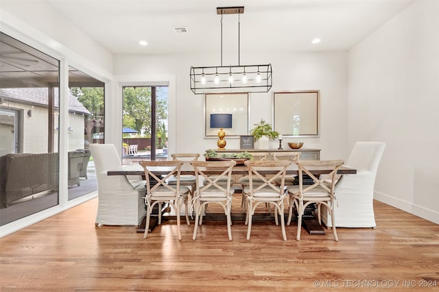 dining space with light hardwood / wood-style floors