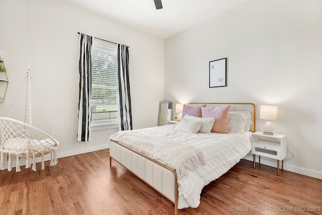 bedroom featuring ceiling fan and hardwood / wood-style flooring