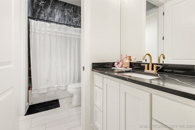 full bathroom featuring tile patterned flooring, vanity, toilet, and shower / bath combo