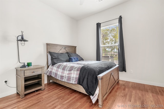 bedroom featuring ceiling fan and light hardwood / wood-style floors