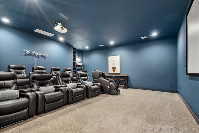 cinema room featuring light carpet