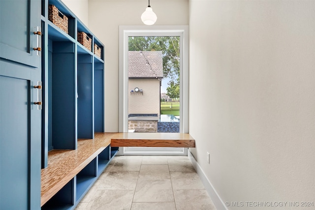 mudroom with light tile patterned floors