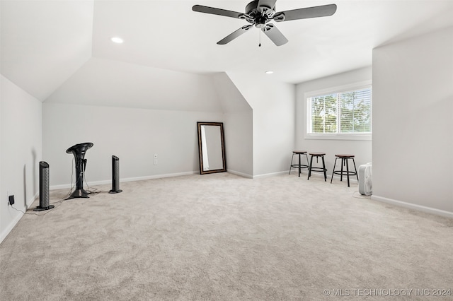 bonus room with ceiling fan, vaulted ceiling, and light colored carpet