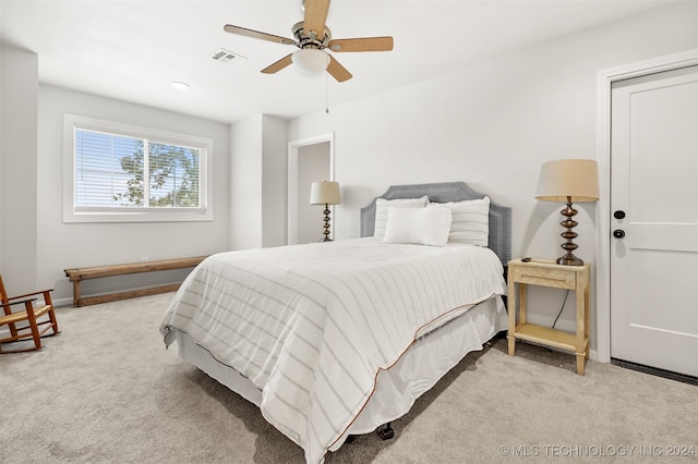 carpeted bedroom featuring ceiling fan