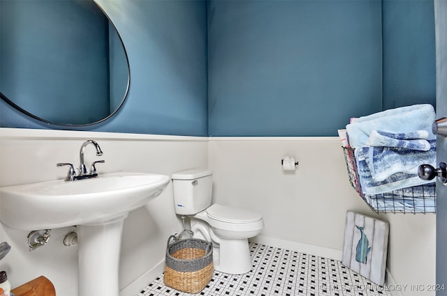 bathroom featuring toilet and tile patterned floors