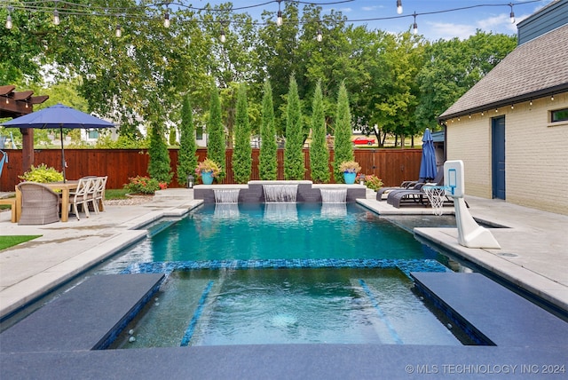 view of swimming pool with a patio area