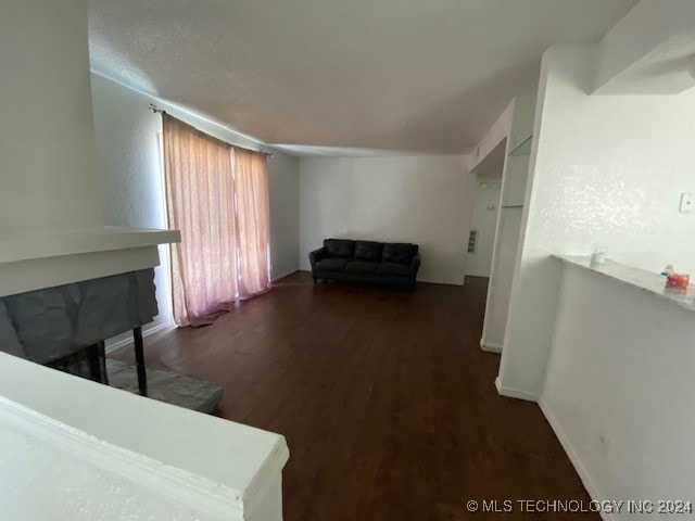 living room with dark wood-type flooring