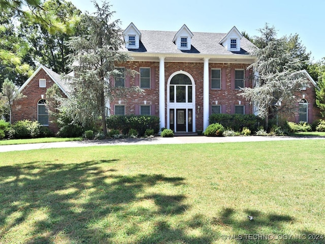 view of front of home with a front yard